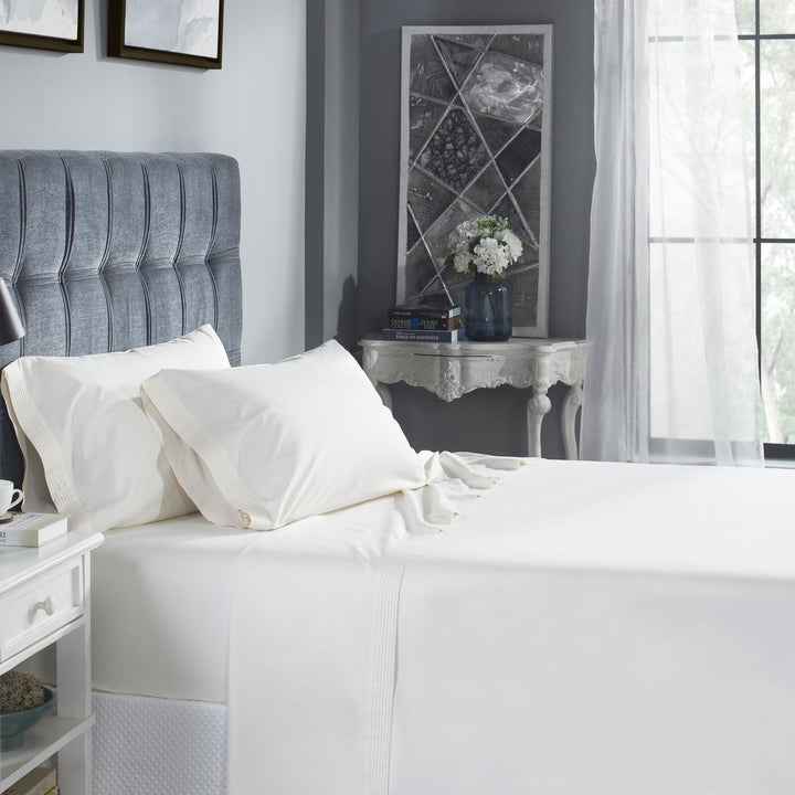 QSS-522-6080_1|Crisp white 100% cotton sheets with elegant pleated details, offering breathable comfort and a sophisticated bedroom style.