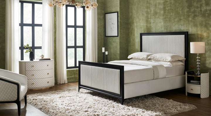 FN-5218-482036_7|Stylish white leather quilted bedroom furniture set, including a bed, oval chest of drawers, and nightstand with gold accents.