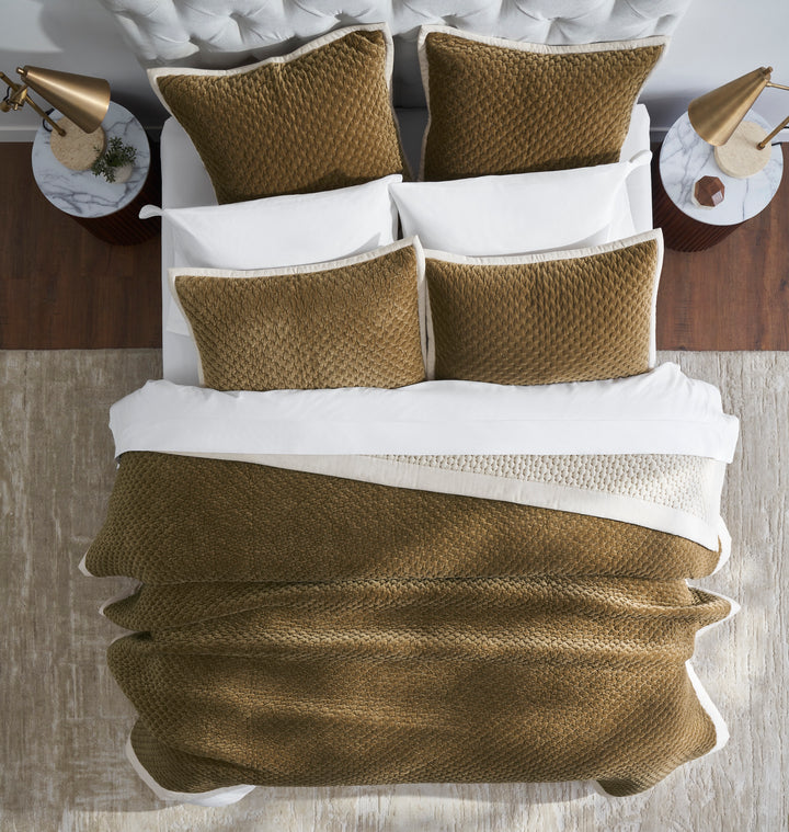QT-378-11096_5|Top-down view of luxurious golden-brown quilted bedspread, matching shams, textured design, and cream trim.