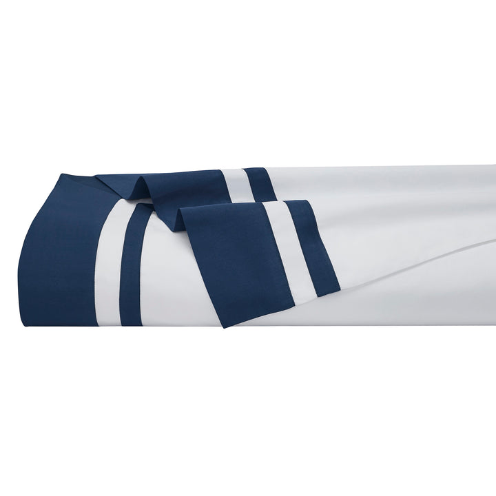 KFL-548-7880_5|Crisp, elegant white 100% cotton sheets, perfectly folded, showcasing a distinctive navy blue striped border detail.
