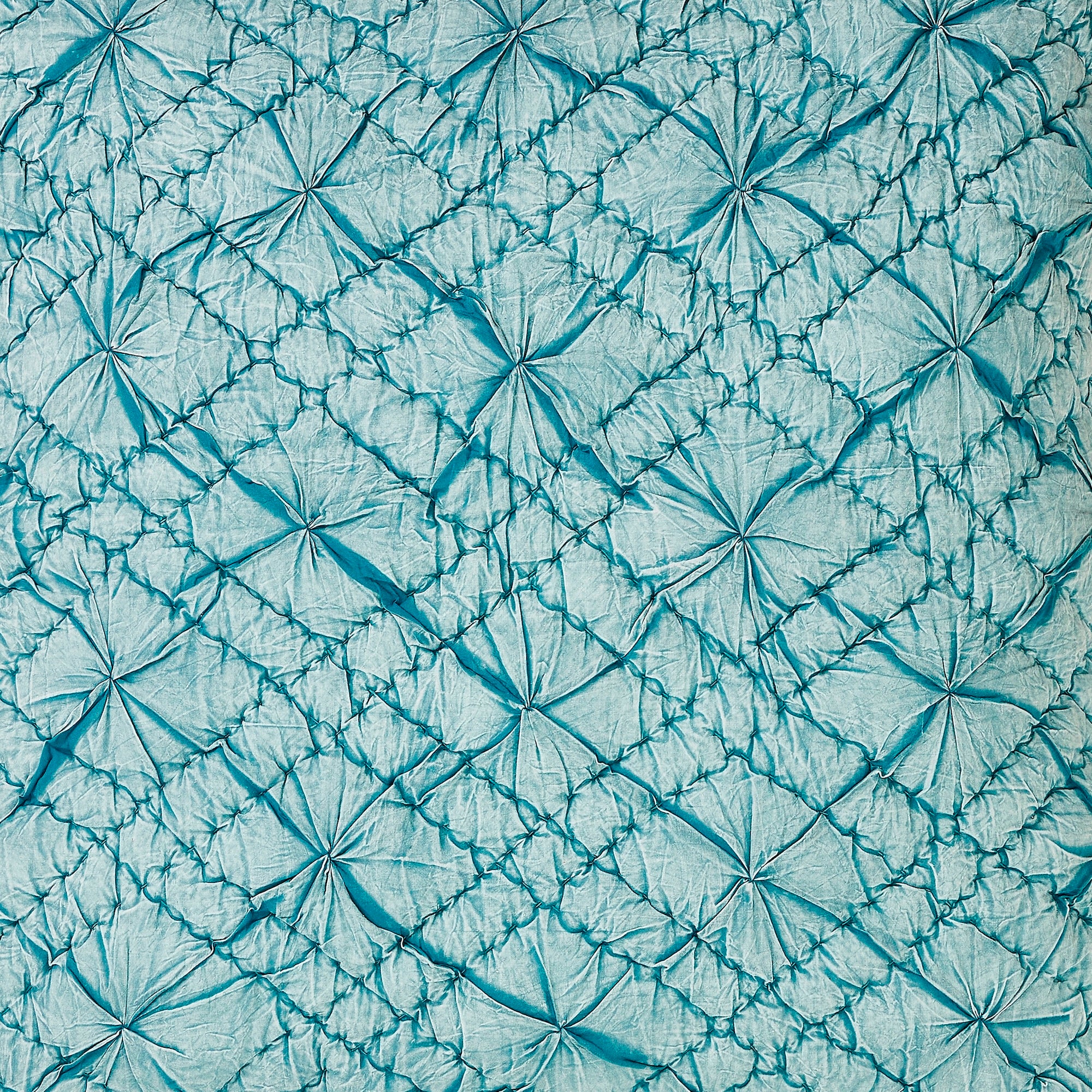 SWT-365-7.8_1|Vibrant teal ruched quilted fabric with a unique dimensional diamond and puff pattern, adding luxurious texture to bedding.