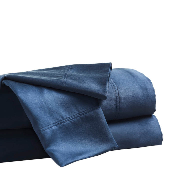 CSS-511-7284_4|Dark blue 100% Lyocell flat and fitted sheets, folded, with a smooth sateen weave texture and visible hemstitching.