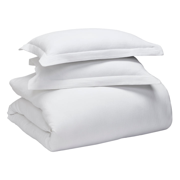 DT-067-9092_9|White textured duvet cover set with two matching pillow shams, luxurious and comfortable bedding for a modern bedroom.