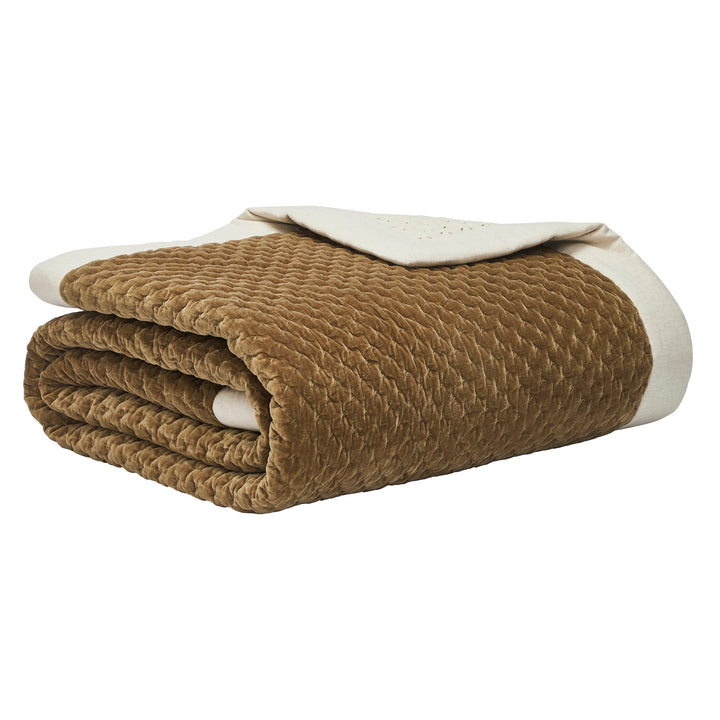 QT-378-9496_10|Neatly folded golden brown quilted velvet bedspread featuring a crisp white linen border, ideal for luxurious comfort.