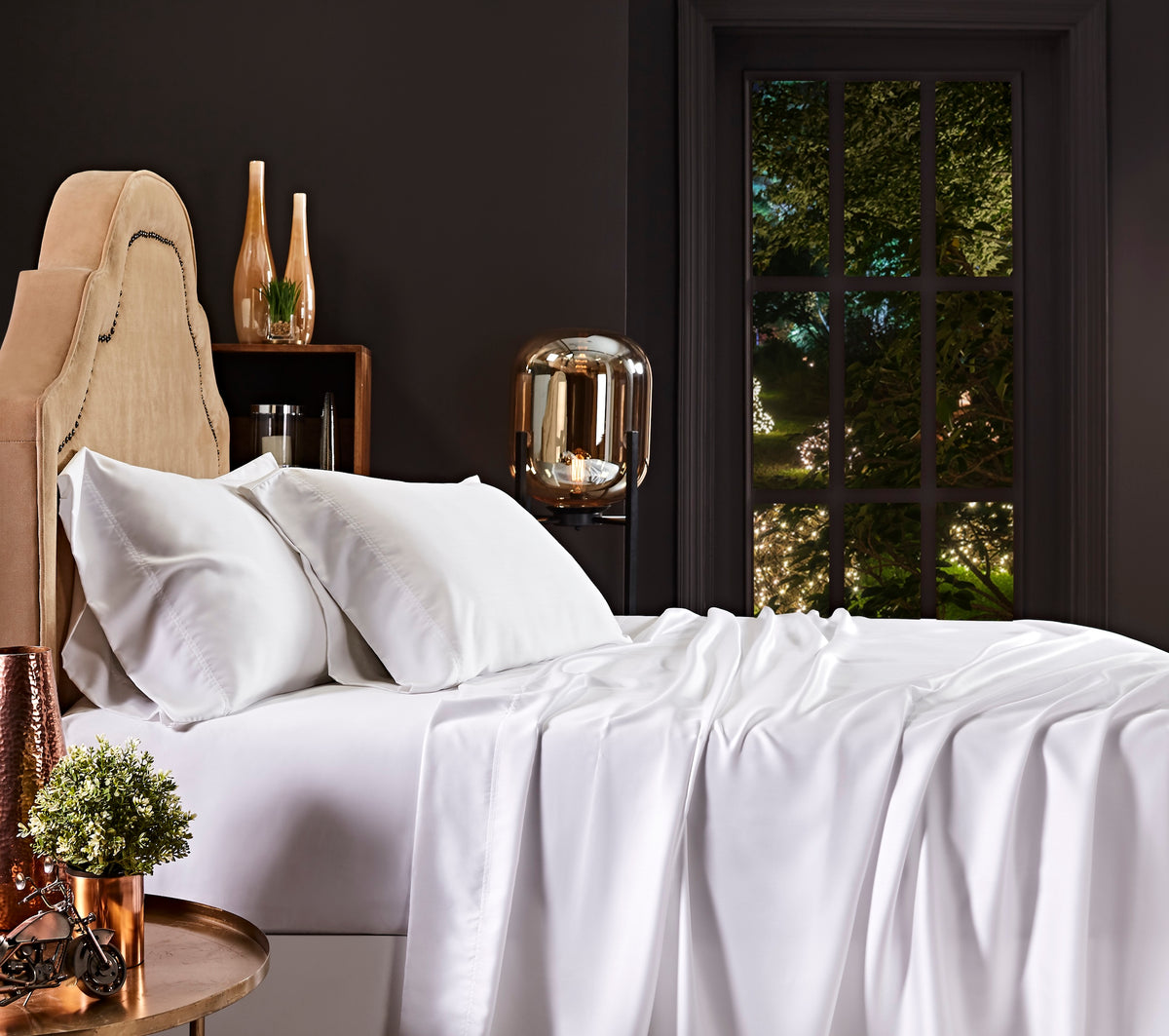 KSS-509-7880_2|White 100% Lyocell sheet set, including a flat sheet, fitted sheet, and two pillowcases, draped loosely on a bed.