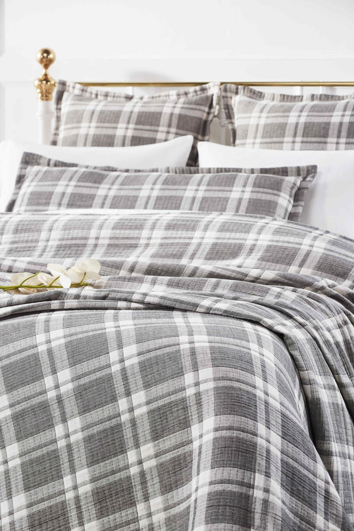 BT-116-11096_1|Cozy grey and white plaid blanket styled on a bed, adding a classic yet modern touch to bedroom decor.