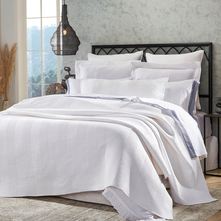 CL-170-11096_2|Luxurious white chevron patterned coverlet draped over a neatly made bed, adding a touch of elegance to bedroom decor.