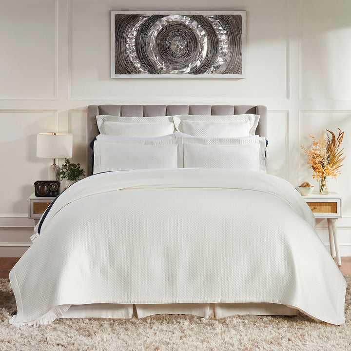 CL-189-9496_1|Elegant white quilted coverlet set with matching shams, gracing a modern grey upholstered bed in a stylish bedroom.