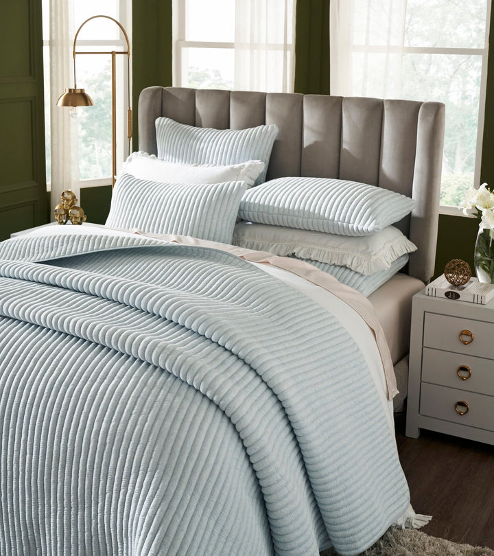 QT-369-9496_3|Close-up of light blue ribbed quilted bedspread, showcasing its unique textured design and soft, inviting comfort.
