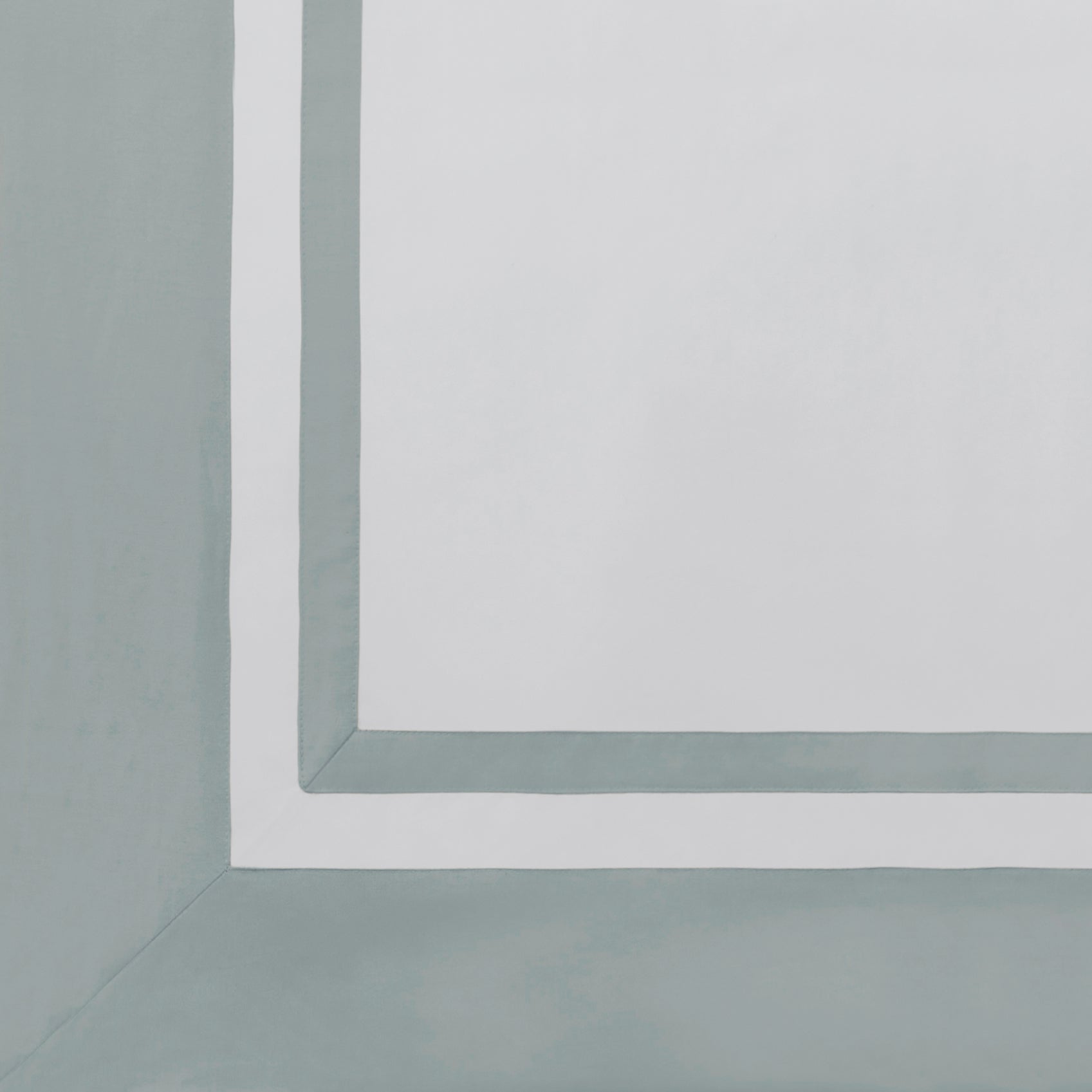AKP-541-2040_5|Close-up of a white 100% cotton sateen flat sheet with a wide light blue border and a thinner white inner border.