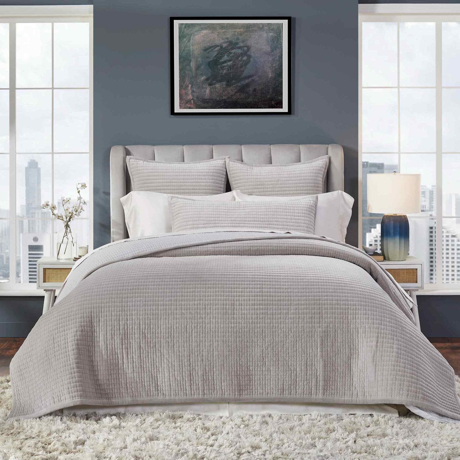 CL-188-9496_3|Modern bedroom with a soft grey quilted coverlet on the bed, showcasing a structured channel quilt design.