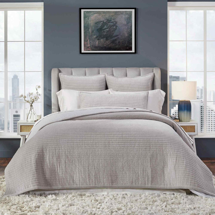 CL-188-9496_3|Modern bedroom with a soft grey quilted coverlet on the bed, showcasing a structured channel quilt design.