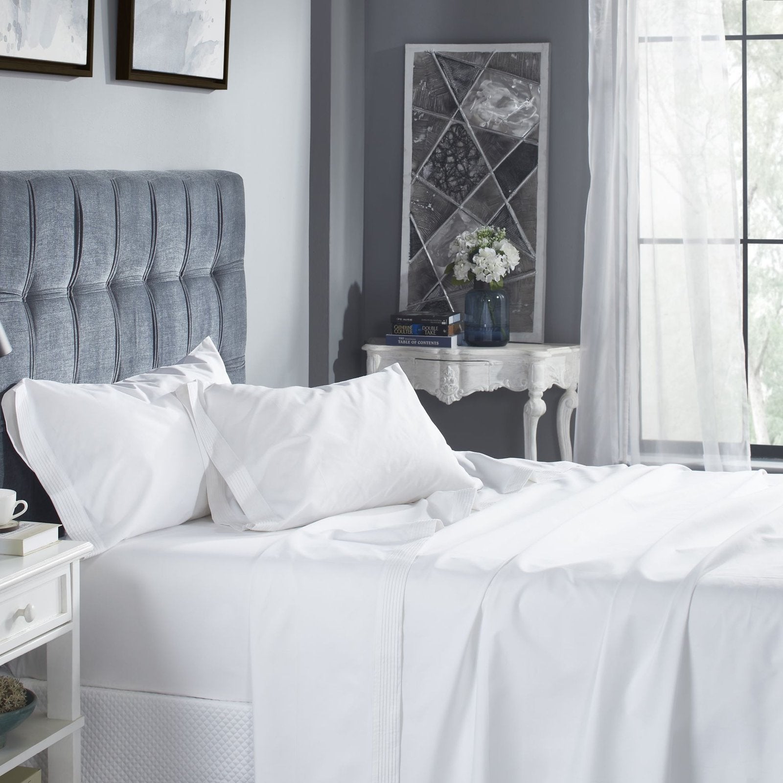 CSS-521-7284_2|Classic white 100% cotton sheet set on a bedroom bed, featuring sophisticated pintuck pleat detailing.