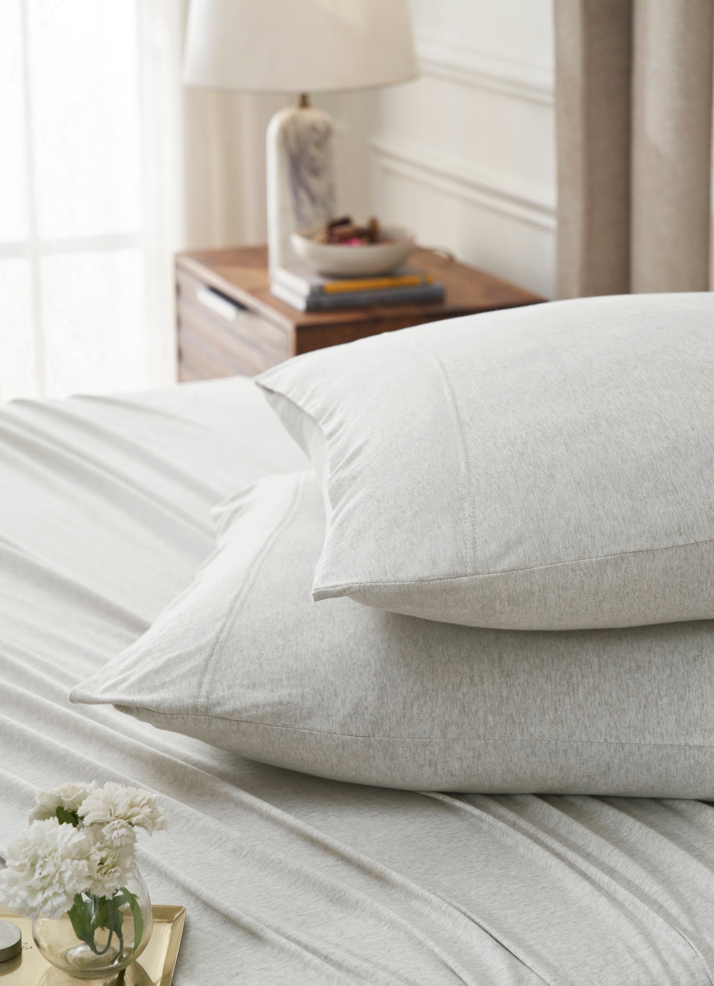 KSS-526-7880_4|Close-up of soft, cozy light beige 100% cotton jersey sheets and pillowcases, highlighting the breathable, relaxed texture.