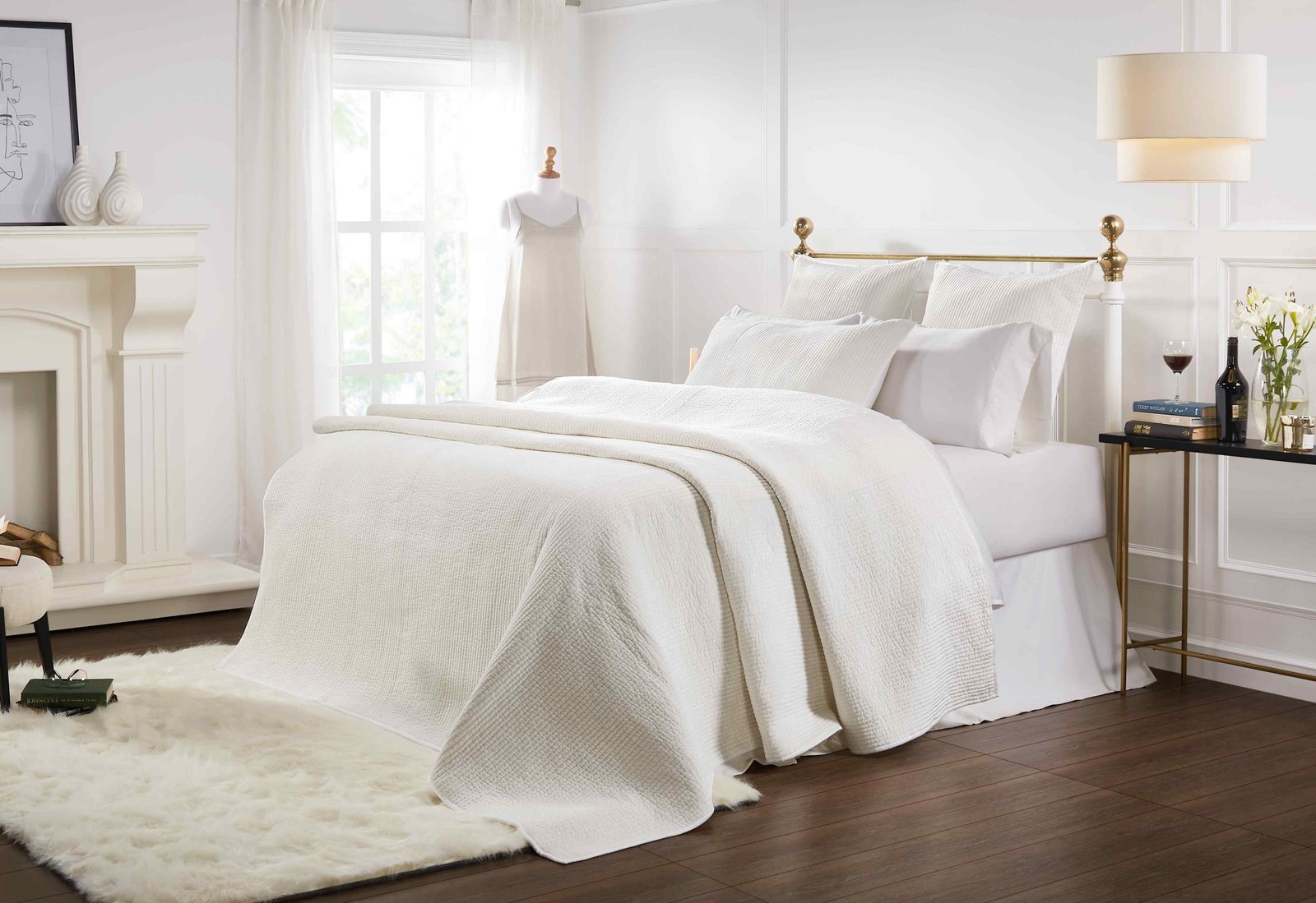 CL-157-11898_3|Pristine white textured coverlet drapes elegantly on a bed, providing a clean, luxurious, and inviting contemporary bedroom look.