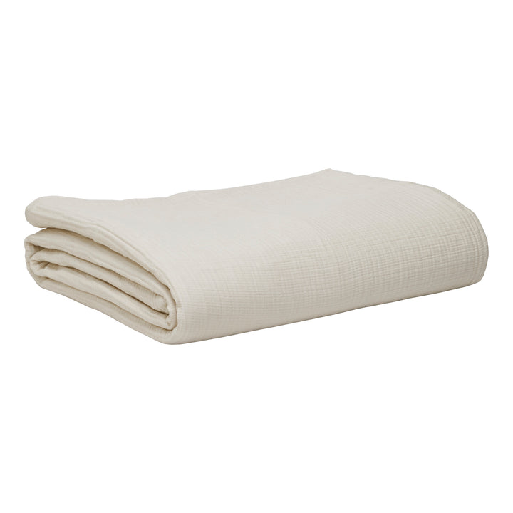 BL-862-9496_7|Neatly folded cream textured blanket, perfect for minimalist bedroom styling or a cozy, breathable layering piece.
