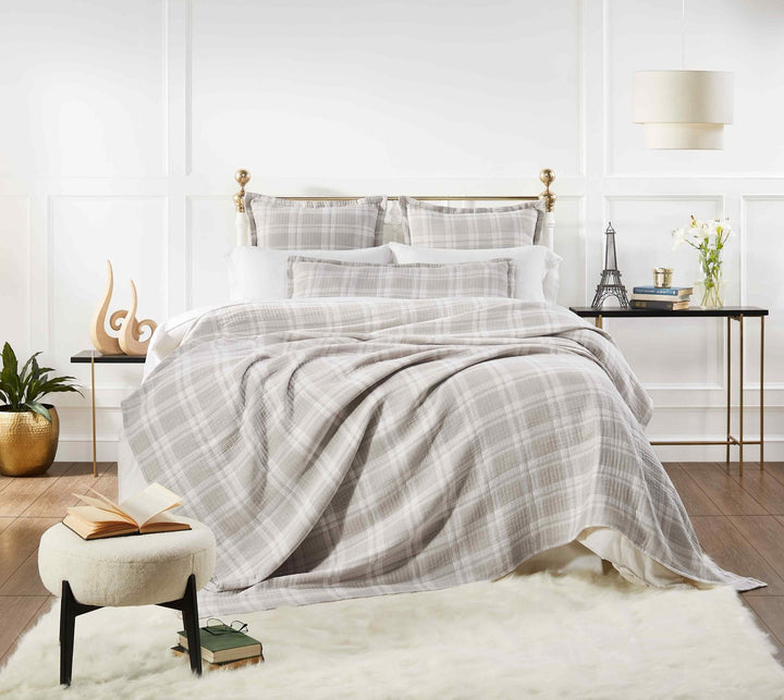 BT-120-9496_1|Cozy beige and white plaid blanket draped casually on a bed, offering supreme warmth and classic, inviting style.