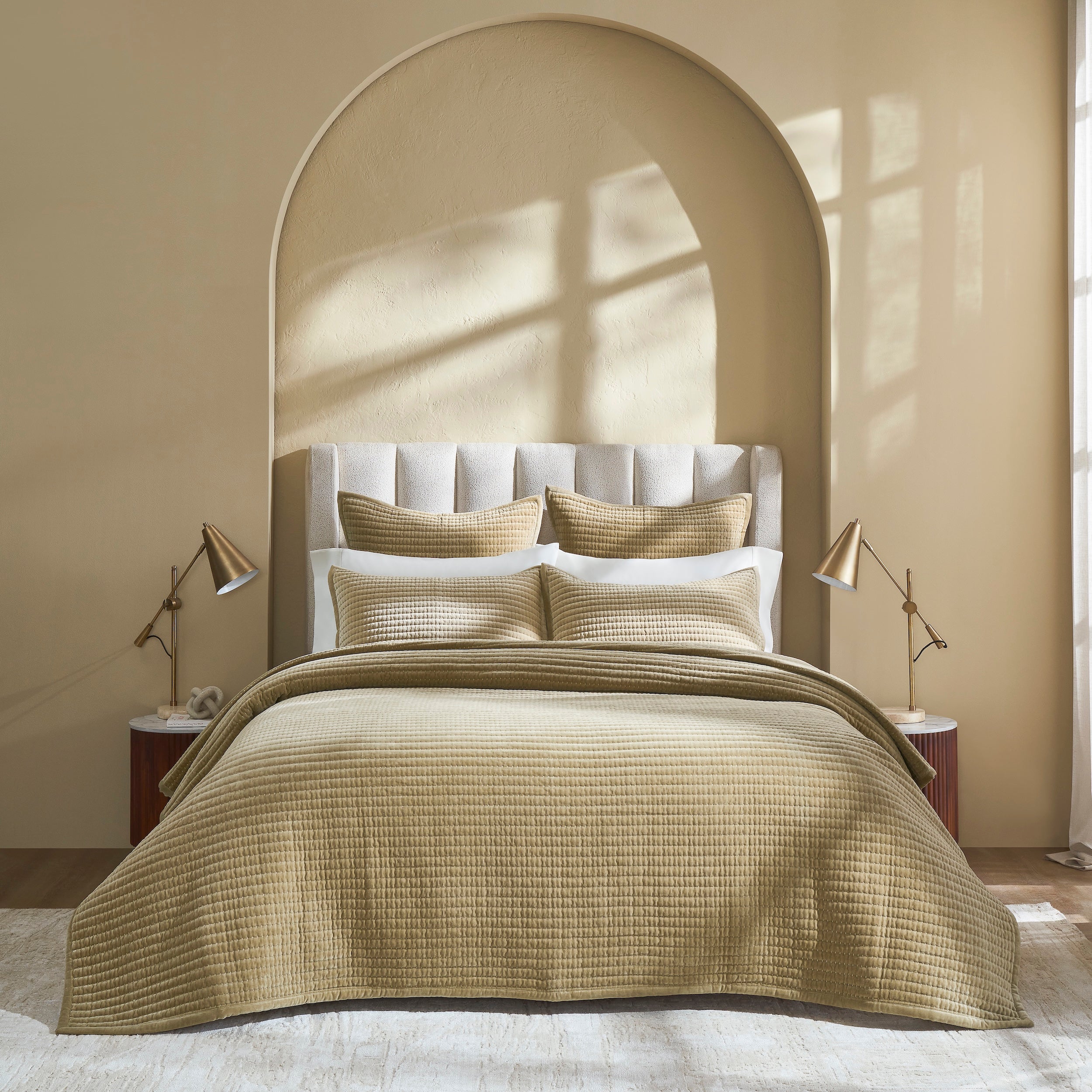 CL-267-9496_1|Gold quilted coverlet beautifully draped on a queen bed, complementing the room's warm tones. Adds elegant texture and comfort.