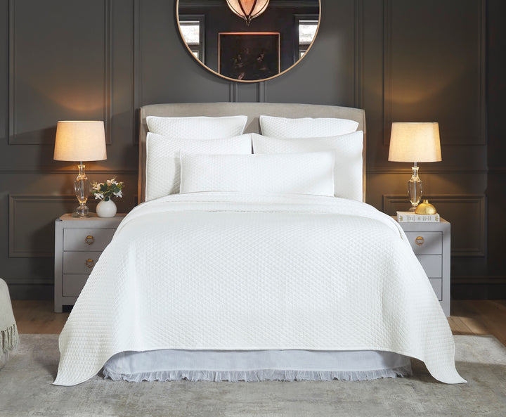 CL-264-X_1|White quilted bedspread with a subtle textured pattern, providing cozy bedding and an elegant touch to any bedroom.