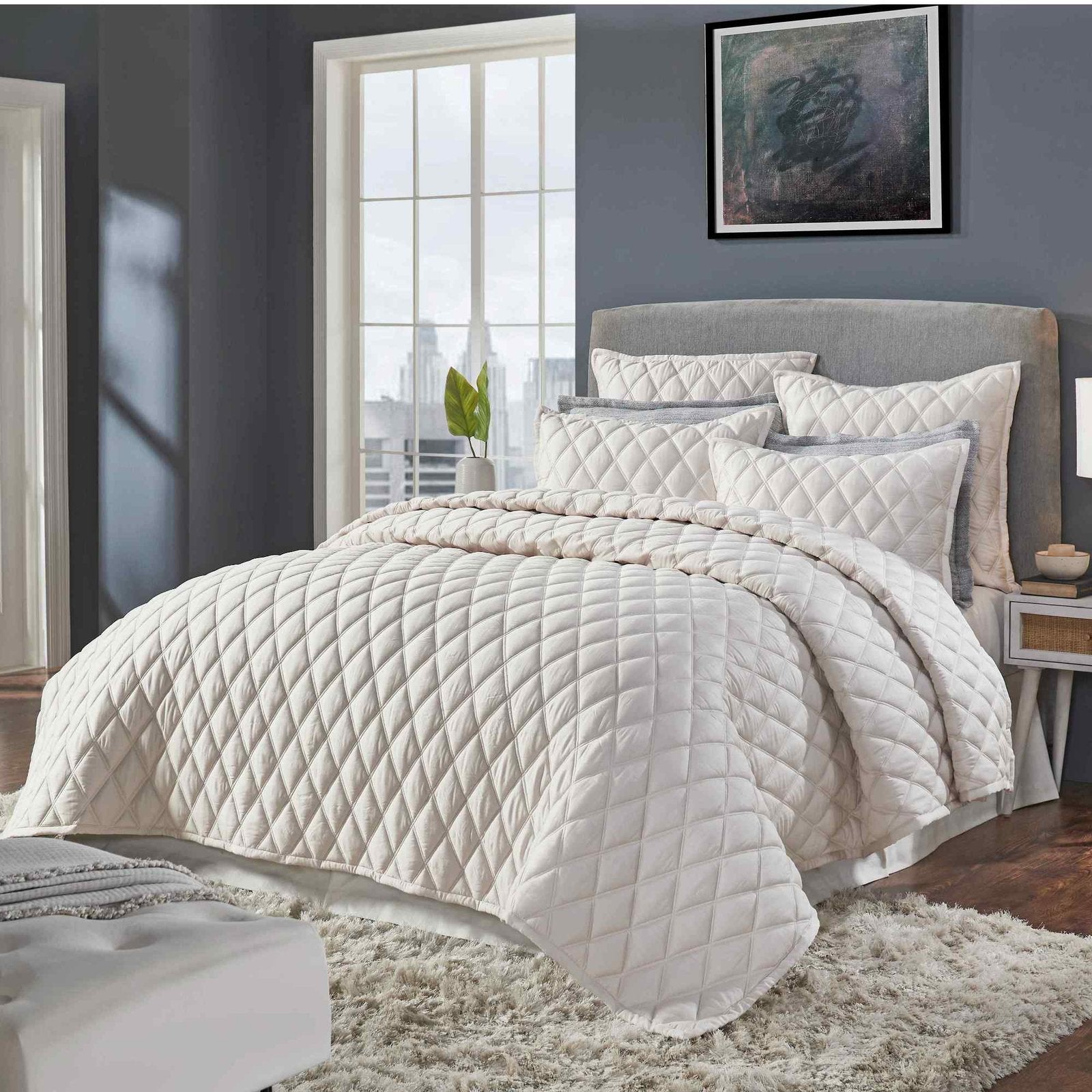CL-180-9496_2|Cream quilted coverlet draped on modern bed, showcasing subtle pattern, enhancing contemporary bedroom decor.