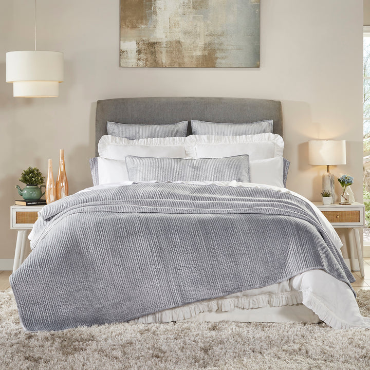 CL-169-11096_1|Plush grey textured coverlet gracefully draped on a modern bed, creating a cozy and inviting atmosphere for stylish bedroom comfort.