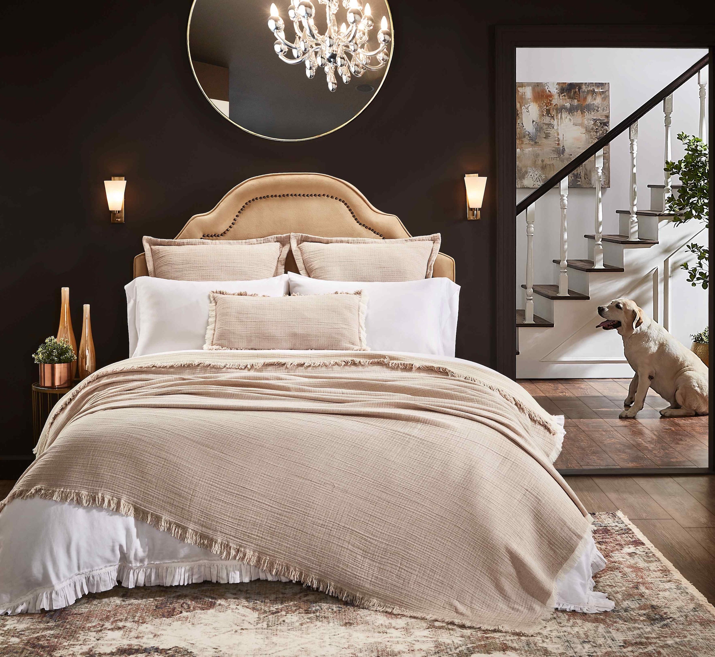 BT-112-11096_2|Elegant, textured light brown blanket with fringe detail covers a luxurious bed, enhancing bedroom comfort and style.