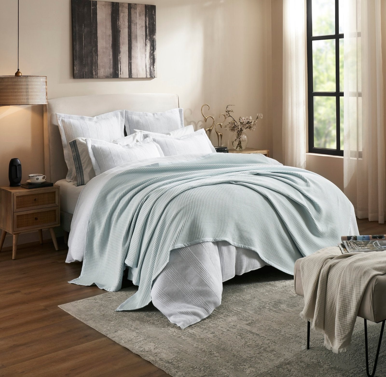 BL-857-11096_2|Light blue waffle knit blanket casually draped on a luxurious bed, offering soft, inviting comfort. (110)