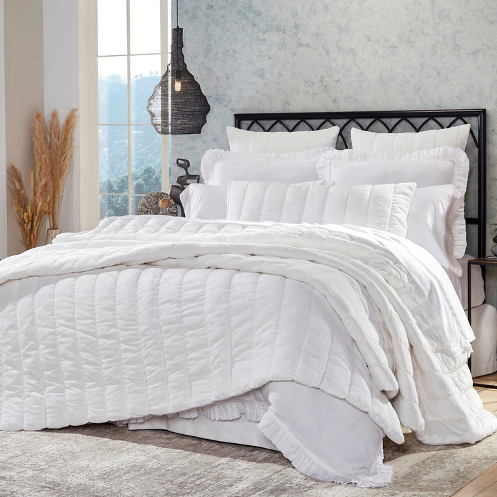 QT-337-9496_2|Crisp white textured quilt with sleek channel quilting on a beautifully styled bed. Modern and inviting bedroom decor.
