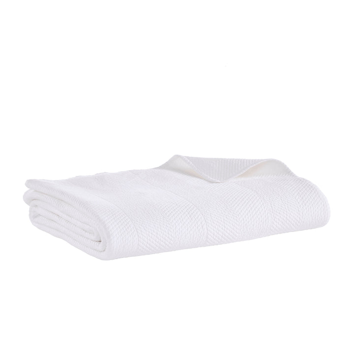 CL-170-11096_6|Pristine white chevron textured coverlet neatly folded, providing a clean, elegant, and modern bedding solution.
