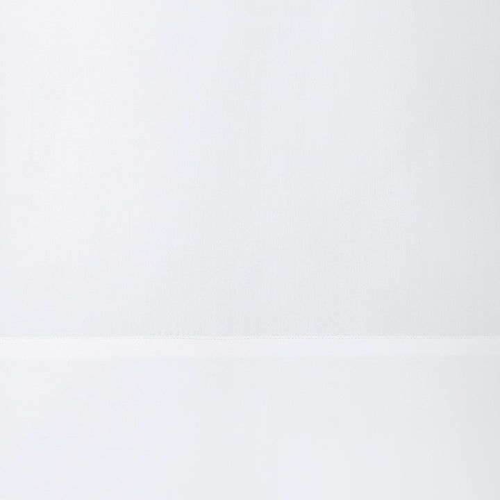 AKP-535-2040_3|Close-up of a crisp white 100% cotton sheet, showcasing smooth fabric and a subtle, durable hemline for pure comfort.