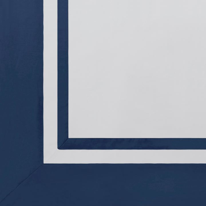 ASP-548-2032_5|Close-up of white 100% cotton flat sheet, showcasing a wide, solid navy blue decorative border.
