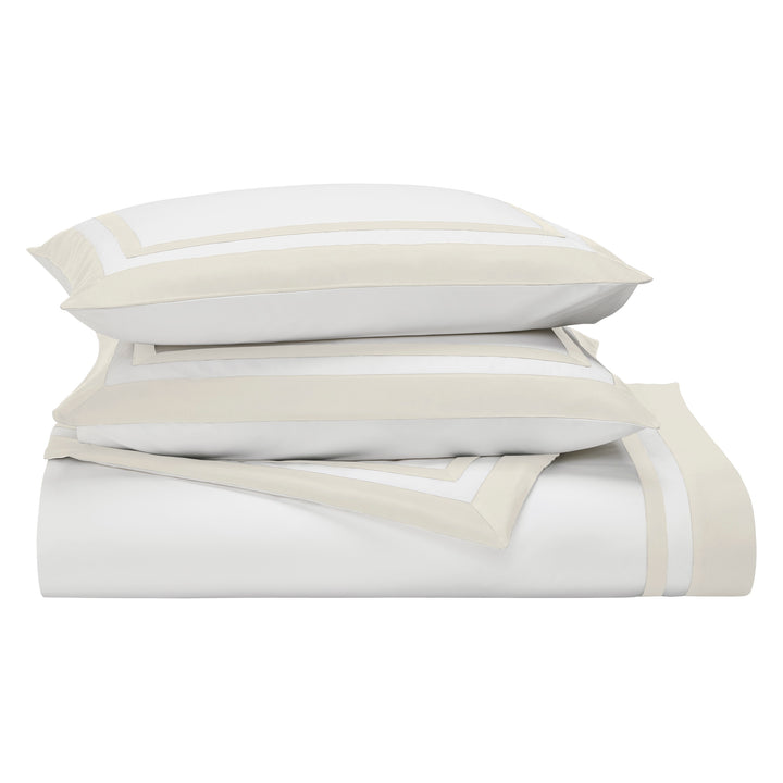 KS-061-2036_3|Folded white duvet cover with elegant light beige border, showcasing premium quality cotton and serene bedroom aesthetic.