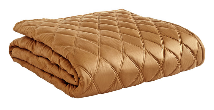 CL-260-9496_5|Neatly folded golden bronze quilted coverlet, featuring a soft diamond pattern, offering versatile and cozy bedroom comfort.