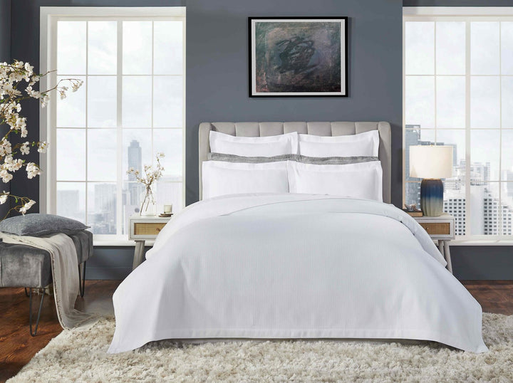 CL-191-11096_1|Elegant white striped coverlet enhancing a modern bedroom, offering a crisp and contemporary bedding solution.