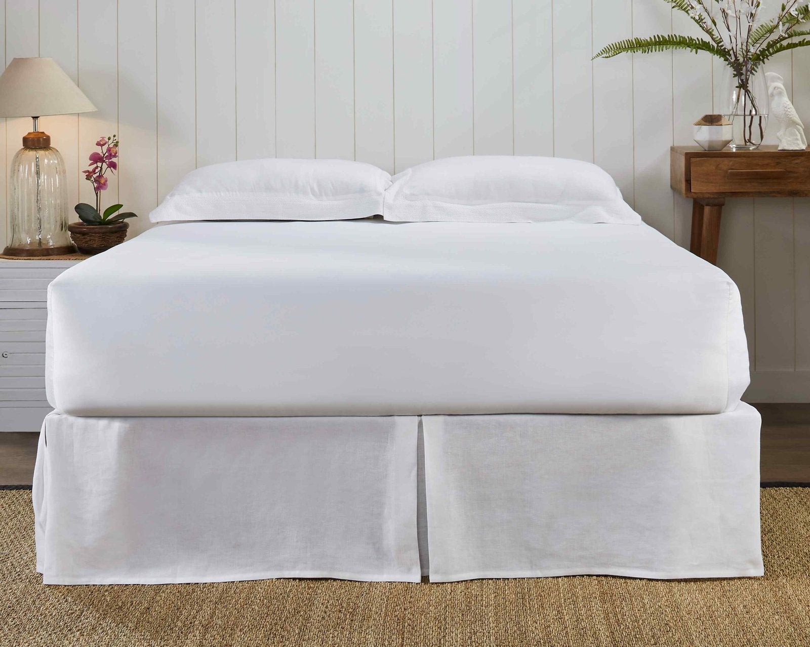 BS-101-X_2|Classic white linen bed skirt with neat pleats on a full bed, creating an elegant and finished look for bedroom.