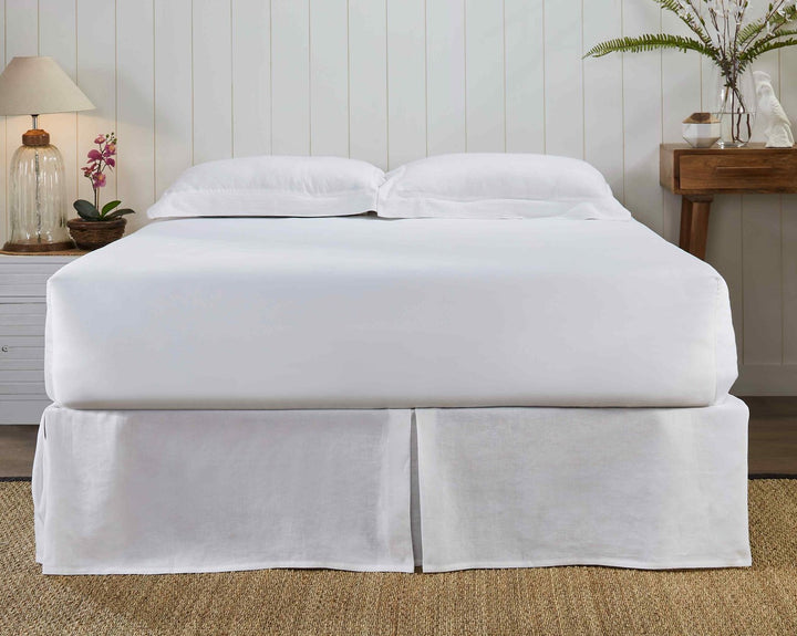 BS-101-X_2|Classic white linen bed skirt with neat pleats on a full bed, creating an elegant and finished look for bedroom.