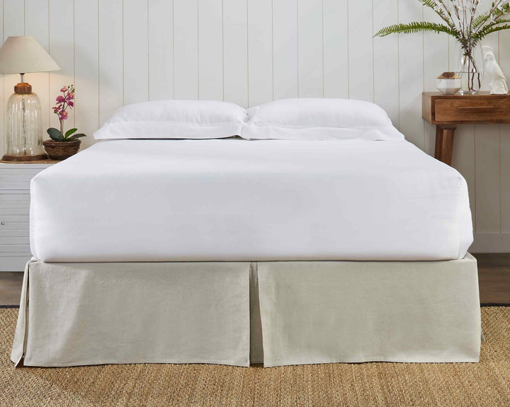 BS-102-6080_2|Minimalist bed setting with a light beige pleated linen-blend bed skirt, offering a tailored and elegant foundation for bedding.