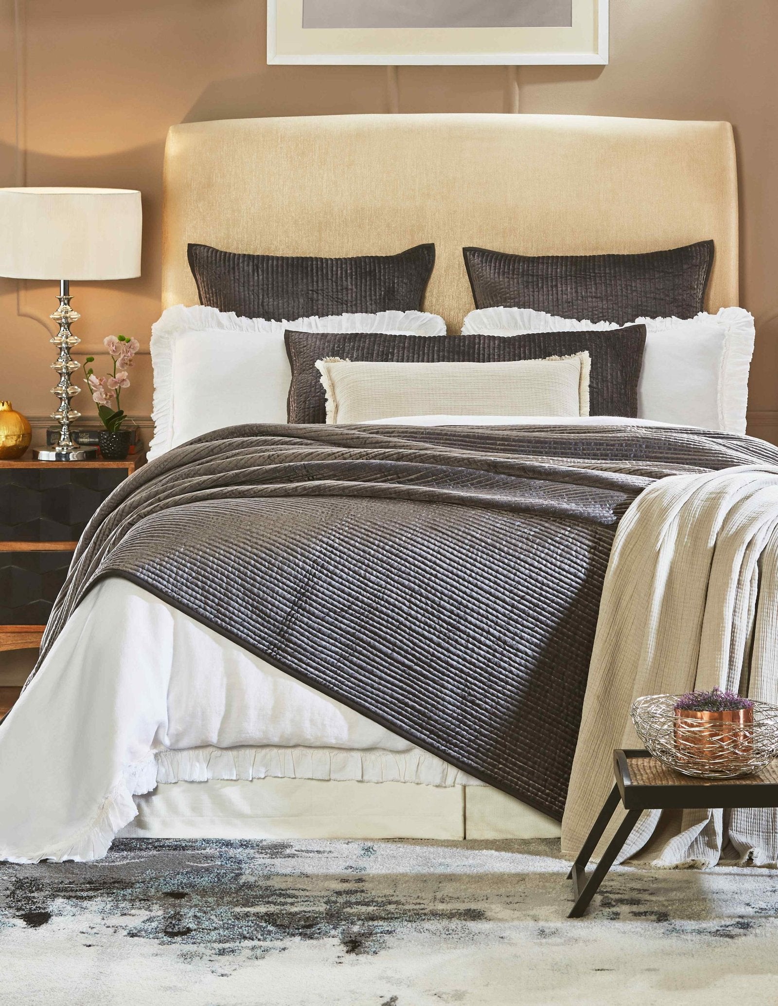 CL-153-9496_1|Luxurious dark grey quilted coverlet draped on a bed, adding elegant texture and warmth to modern bedroom decor.