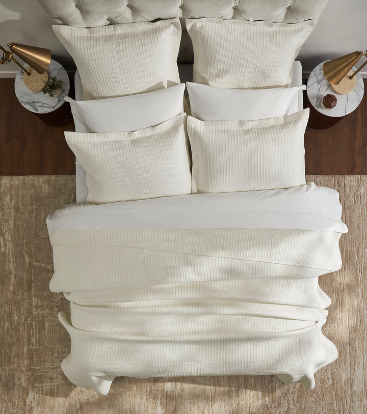 CL-271-11096_4|Luxurious cream textured coverlet, neatly draped on a bed. Soft, inviting bedding for a comfortable and stylish bedroom.