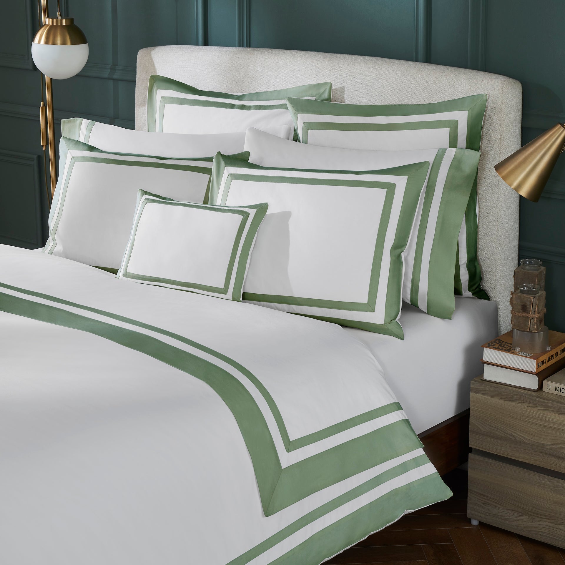 DT-069-X_2|White duvet cover with green double stripe border, paired with matching pillows in a modern bedroom setting. Luxurious and inviting bedding set.