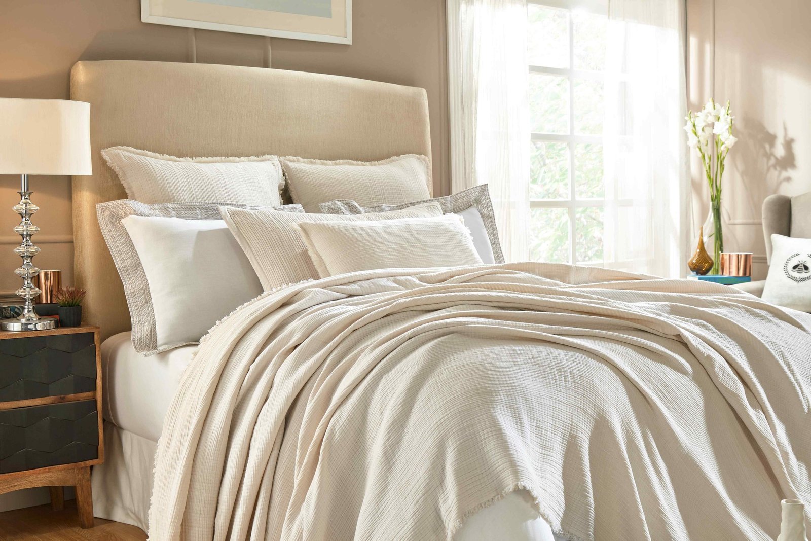 BT-103-X_1|Cozy cream crinkled throw blanket draped over a bed with matching shams. Adds soft texture and comfort to any room.