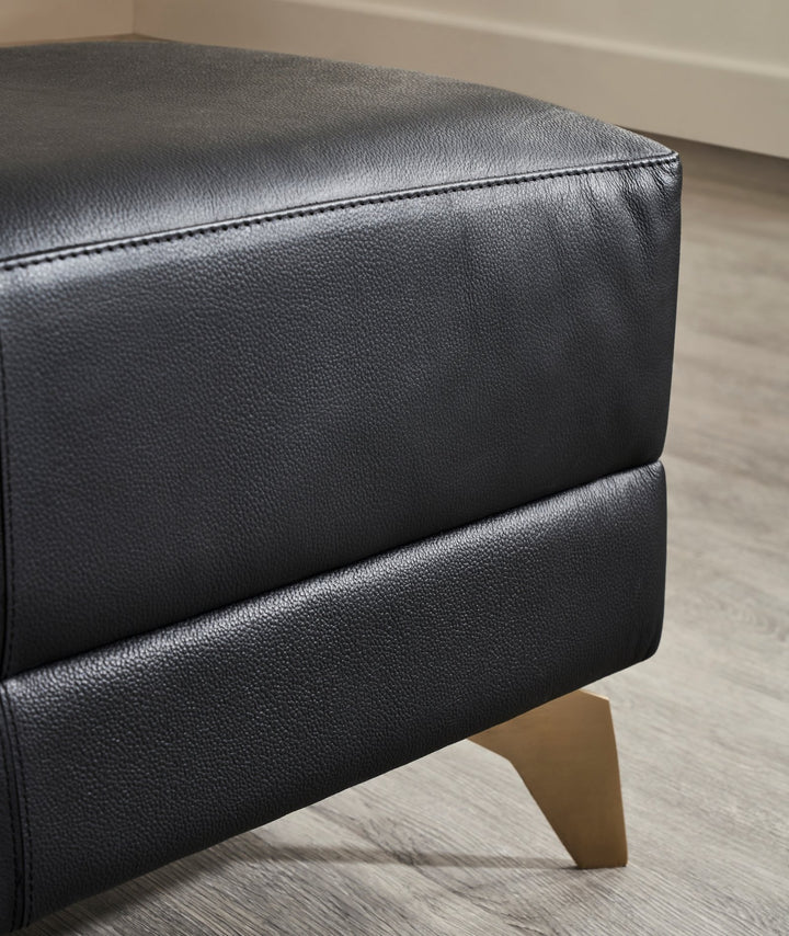 FN-5200-601618_3|Close-up of premium black leather bench, highlighting textured upholstery and elegant gold finish on tapered furniture legs.
