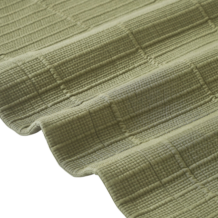 CL-270-11096_12|Close-up of sage green textured cotton blend coverlet, showcasing soft fabric and intricate woven stripe pattern.