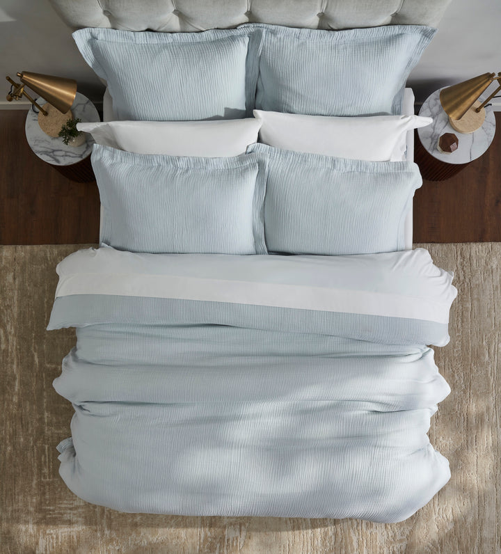 DT-050-9092_5|Overhead view of a light blue textured duvet cover, highlighting its soft fabric and inviting comfort for a restful sleep.