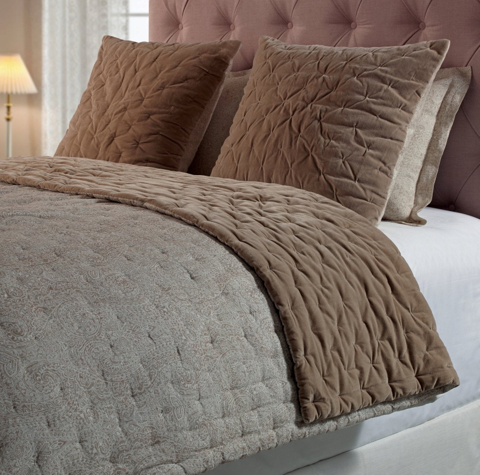 ES-303-2626_2|Luxurious taupe velvet quilted quilt and shams layered over a patterned quilt for an inviting bedroom.