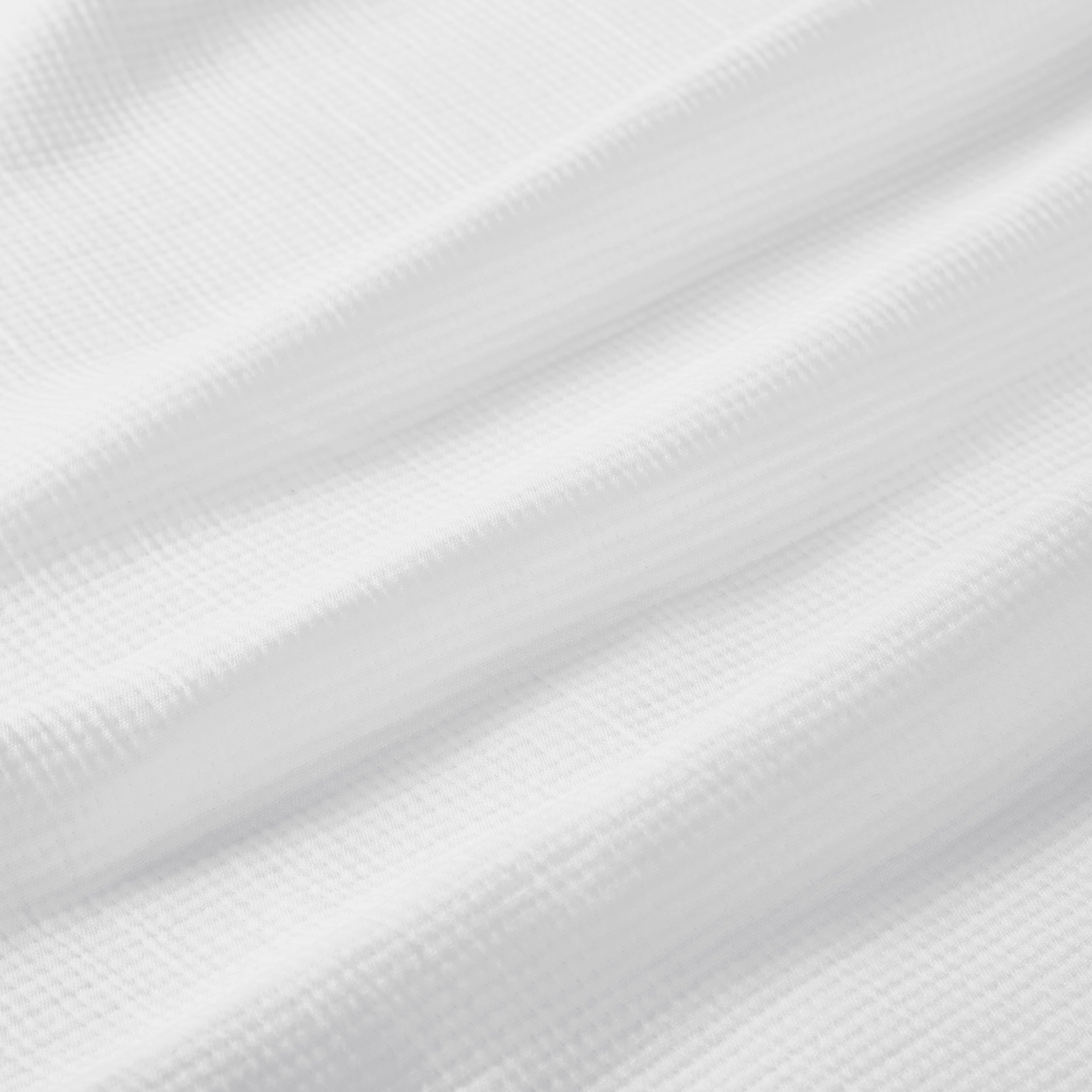 BL-858-9496_9|Close-up of white waffle weave blanket texture. Soft, breathable cotton blanket for cozy layering, providing comfort and simple elegance.