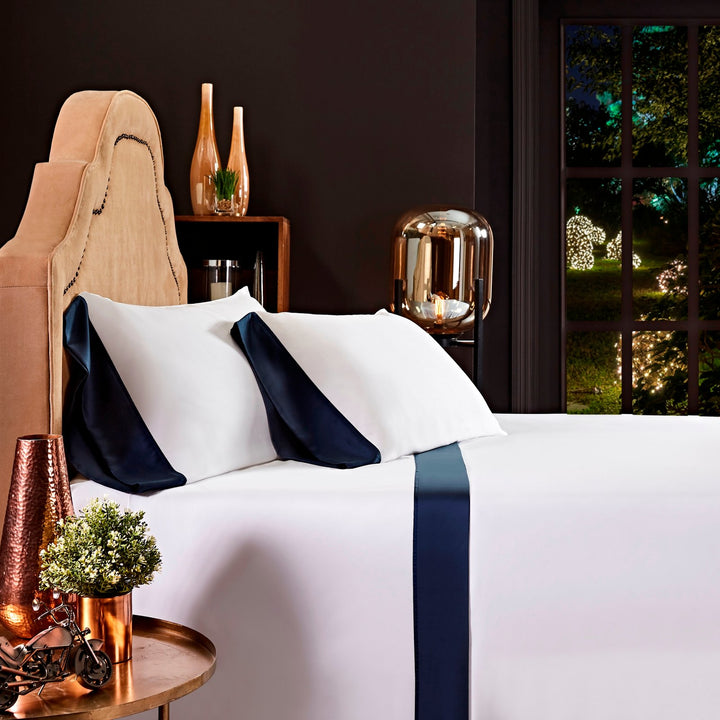 QSS-512-X_1|Elegant white sheet set with a bold navy blue stripe and pillow shams, providing a luxurious bedding look.