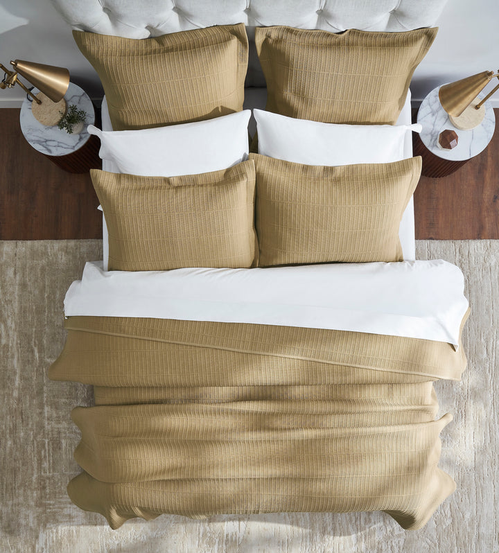 CL-269-9496_4|Luxurious tan textured coverlet with ribbed design, paired with matching pillow shams and crisp white bedding for a modern bedroom.