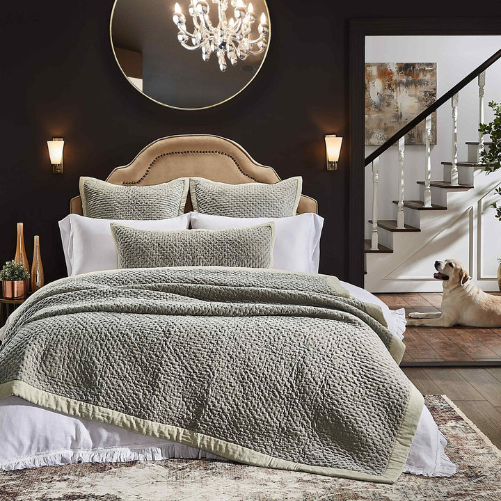 QT-330-9496_3|Inviting sage green woven quilt with a textured honeycomb pattern, gracefully layered on a bed, enhancing a calm and cozy bedroom setting.