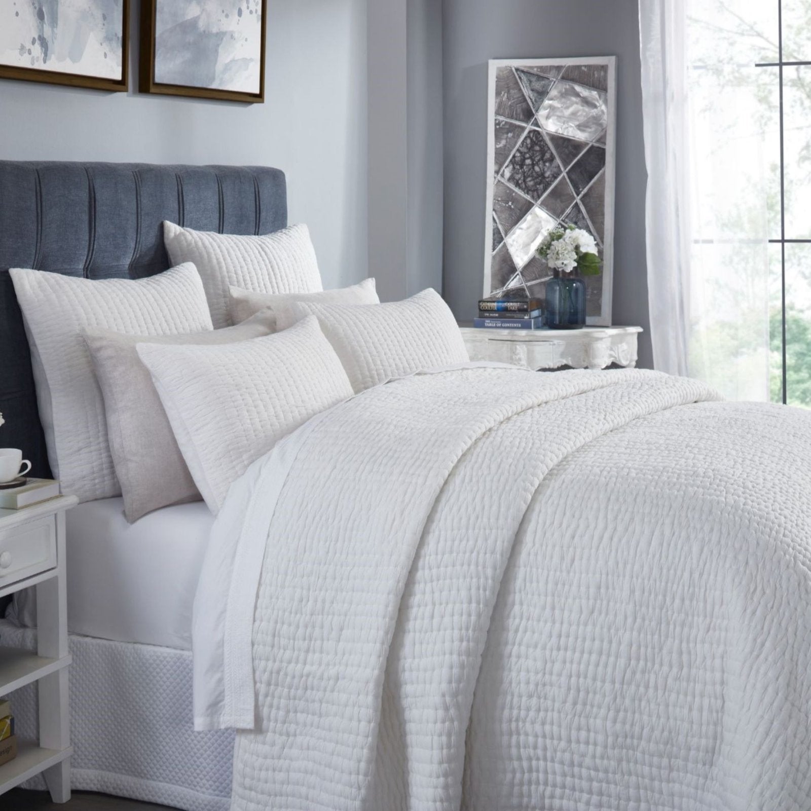QT-359-9496-LOT1_3|Crisp white quilted duvet cover and shams adorning a stylish bedroom setting. Textured cotton quilt adds comfort and elegance.